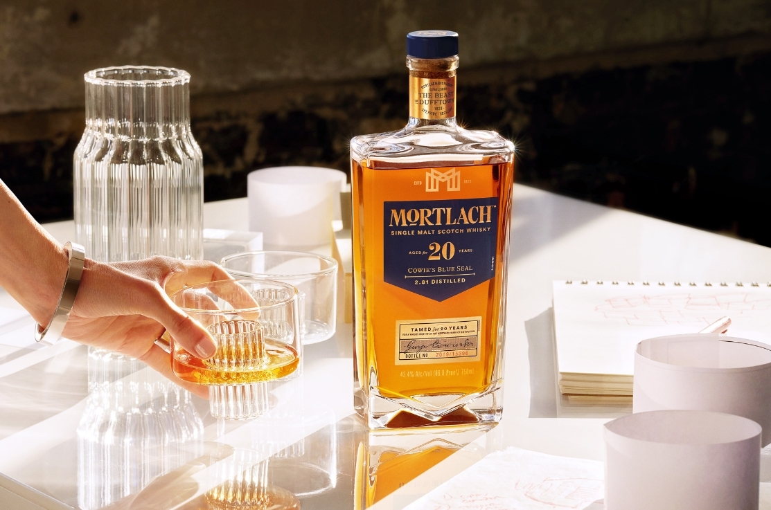 Three bottles of whisky on a counter