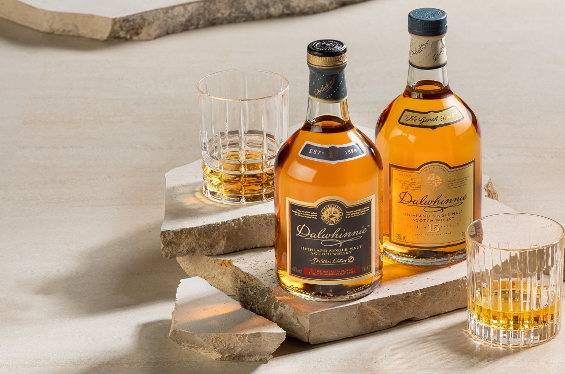 Whisky Bottle On Wooden Table