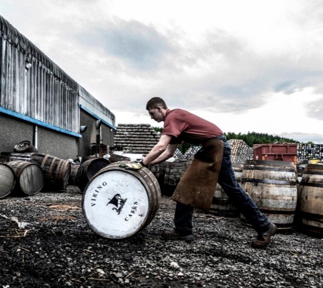 Man rolling a barrel