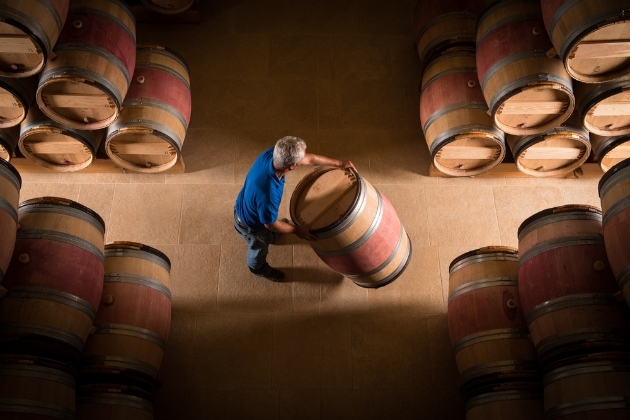 Man pushing barrel
