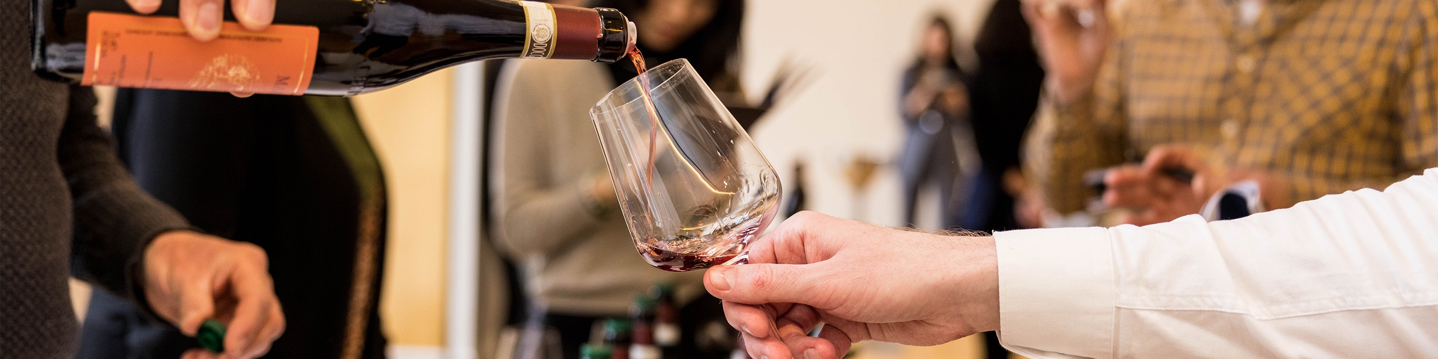 Red wine being poured into a glass