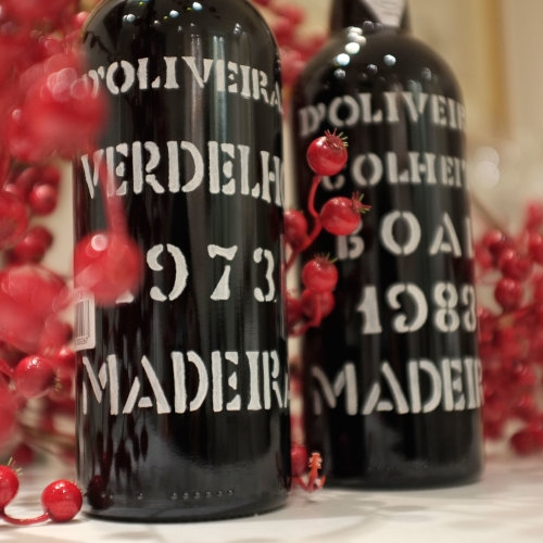 Two bottles with white stamped text