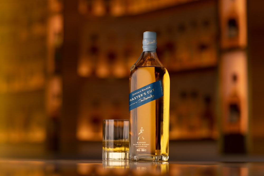 masters cut bottle next to glass