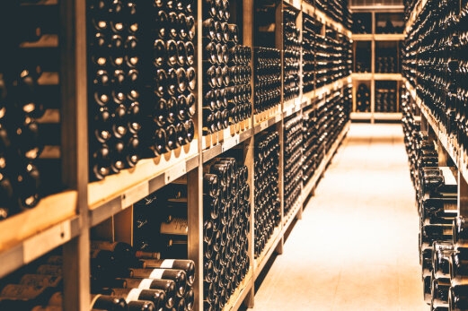 Rows of bottles of wine stacked