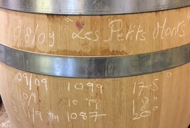 Close up of a barrel with dates etched onto the side