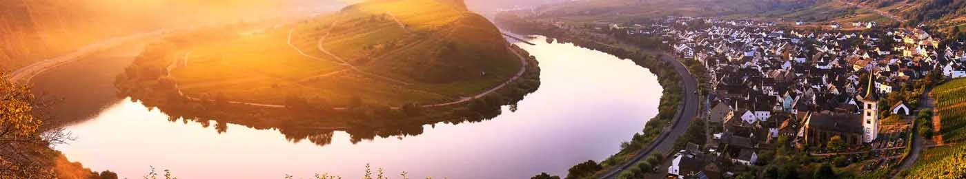 Village by a lake at sunset