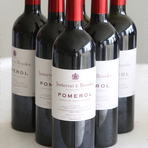 collection of wine bottles with white labels