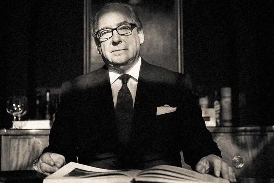 Black and white, Hew Blair with a book 