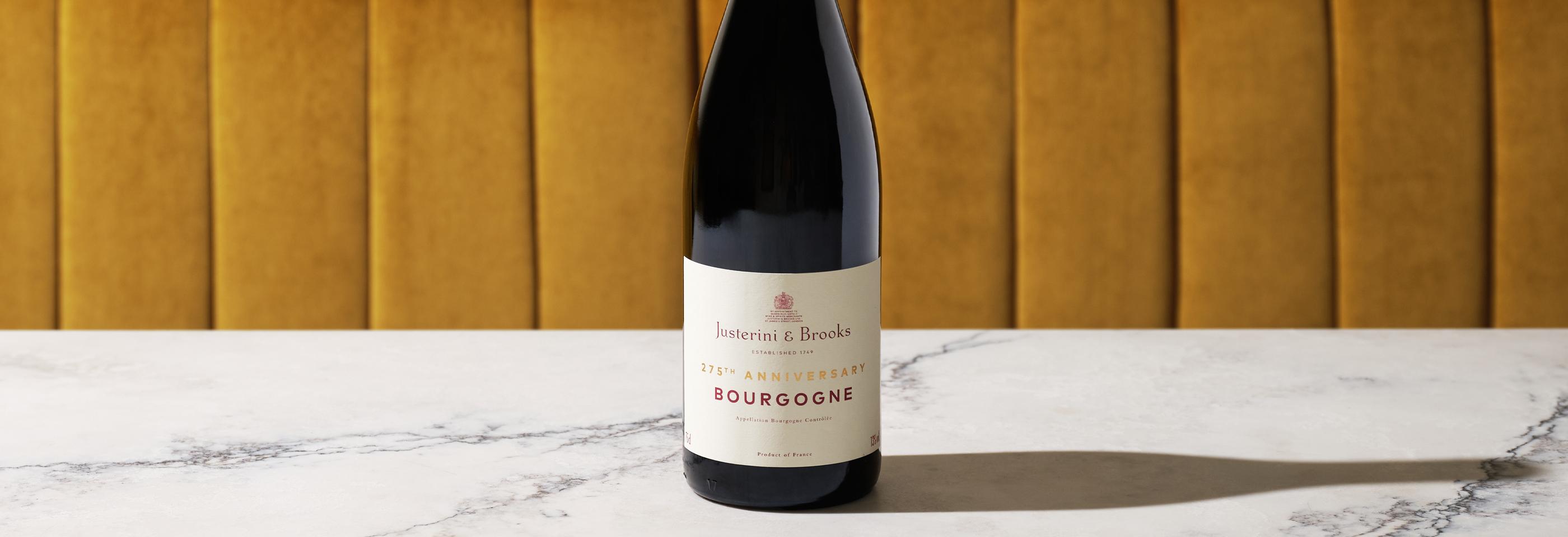 bottle of J&B burgundy on table