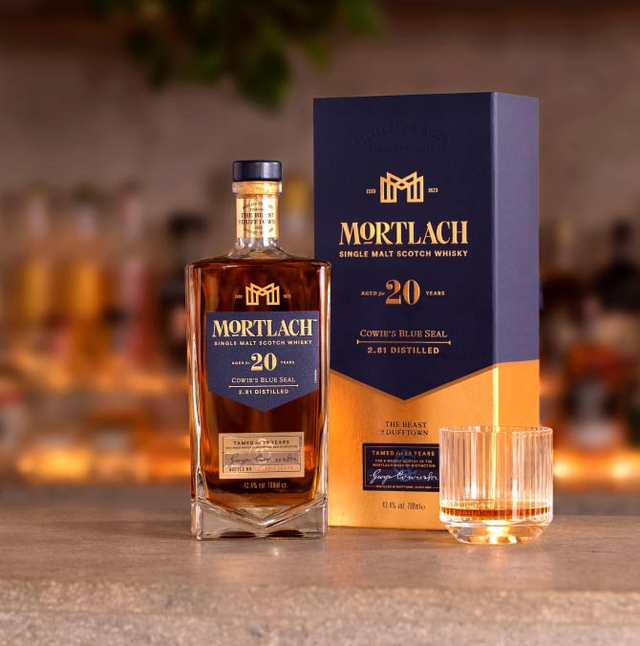 mortlach whisky bottle on a table placed next to a blue and gold branded box