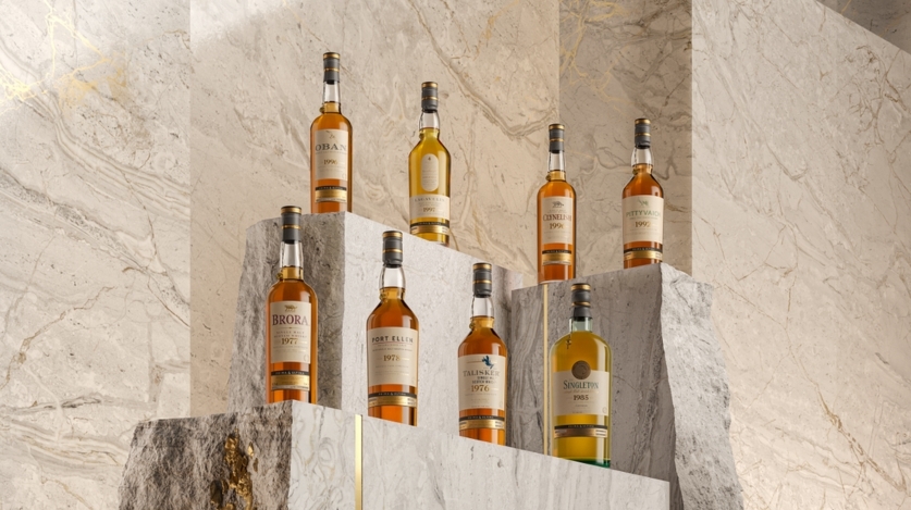 collection of whisky bottles on rocks