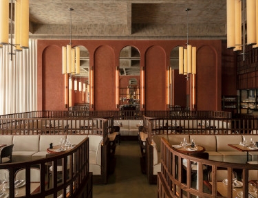 interior of a restaurant with modern seating and brown finishings