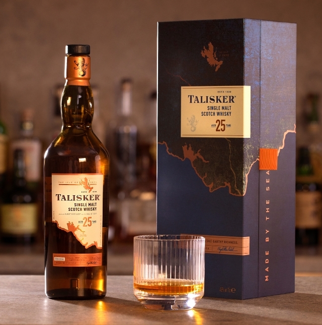 talisker whisky bottle next to a blue branded box